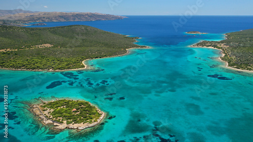 Aerial drone photo of beautiful paradise secluded island complex in gulf of of Petalioi or Petalion that form a blue lagoon with sandy turquoise beaches, South Evoia island near Marmari, Greece