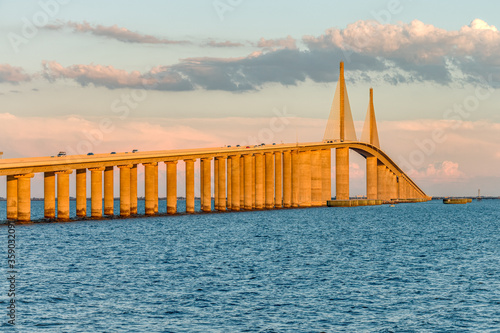 sun setting on bridge photo