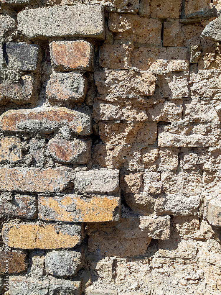 old brick stone wall of a residental building old brick stone wall of a residental building