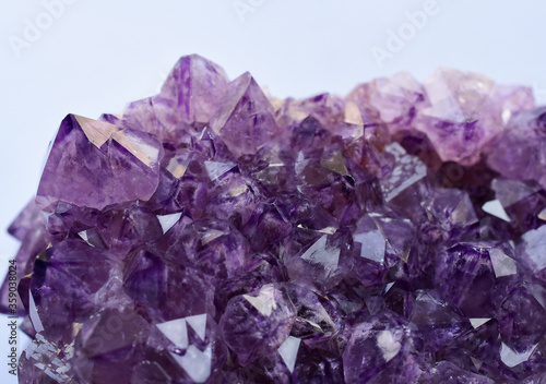 Amethyst druse close-up on a light background