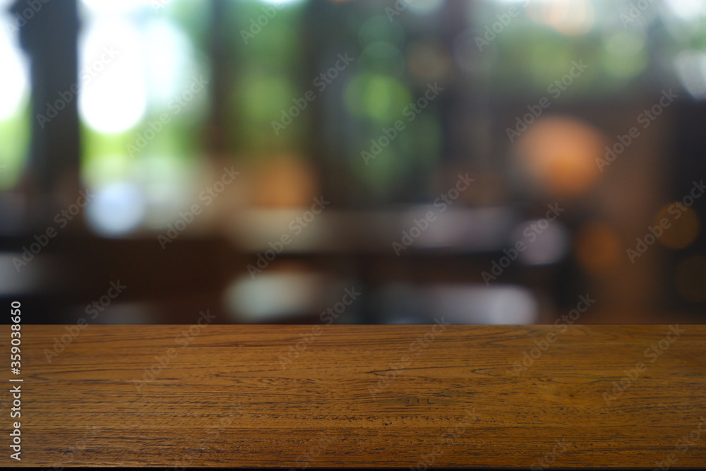 Empty wooden table in front of abstract blurred Cafe, restaurant, house interior. For montage product display or design key visual layout - Image Empty wooden table in front of abstract blurred Cafe, restaurant, house interior. For montage product display or design key visual layout - Image