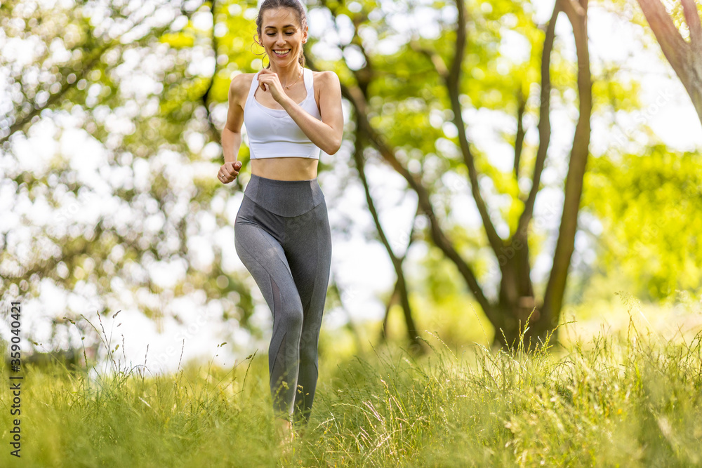 Young woman jogging in nature
