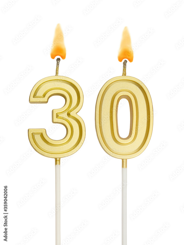 Burning golden birthday candles isolated on white background, number 30 Burning golden birthday candles isolated on white background, number 30
