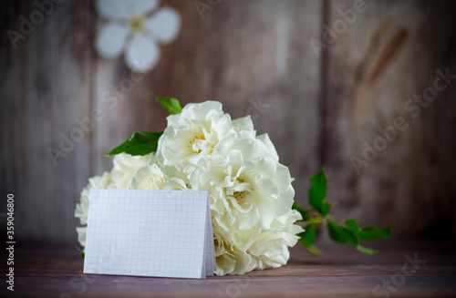 bouquet of beautiful white roses on table