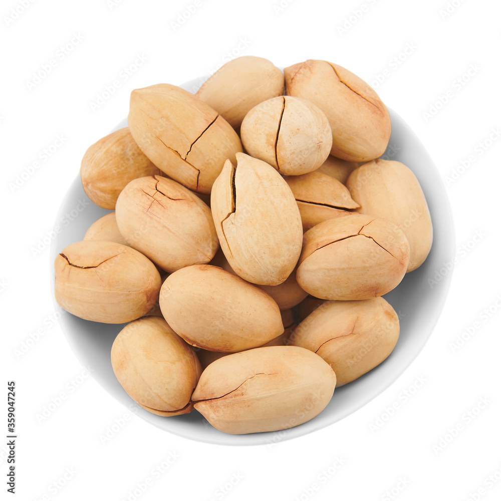 Obraz premium Pecan nuts in shell, in piala, isolated on a white background