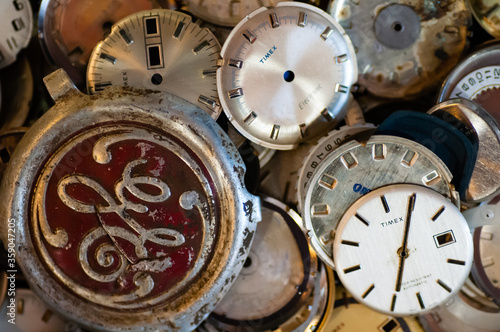 Pile, jumble of watch, clock dials.