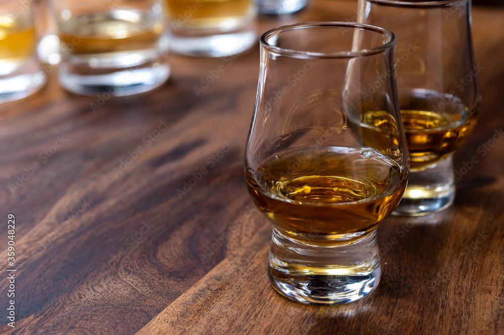 Scotch single malt or blended whisky tasting on distillery in Scotland, UK Scotch single malt or blended whisky tasting on distillery in Scotland, UK