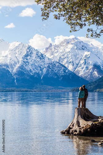 A young couple enjoying some amazing views of the mountains in Patagonia, near Bariloche in Argentina