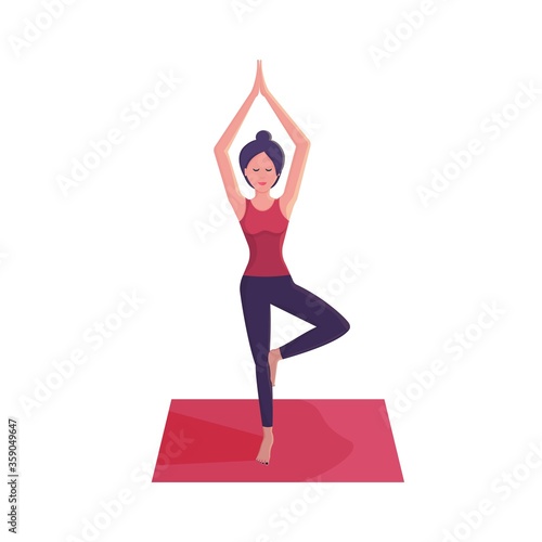 Smiling young woman practicing yoga, doing yoga exercise on pink mat, standing in tree pose, yoga pose, Vrksasana