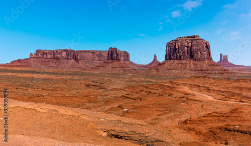 A panorama view of Merrick Butte, Elephant Butte, East Mitten Butte and West Mitten Butte in Monument Valley tribal park in springtime