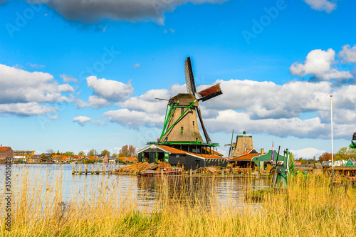 It's Windmill in Zaanse Schans, quiet village in Netherlands, province North Holland