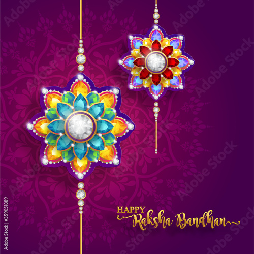 Decorated rakhi for Indian festival Raksha Bandhan Greeting Card ,indian festival with gold patterned and crystals on paper color Background.