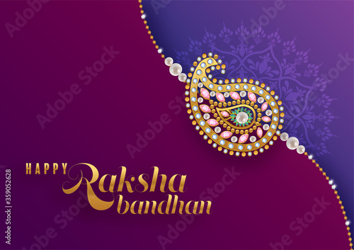 Decorated rakhi for Indian festival Raksha Bandhan Greeting Card ,indian festival with gold patterned and crystals on paper color Background.