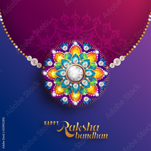 Decorated rakhi for Indian festival Raksha Bandhan Greeting Card ,indian festival with gold patterned and crystals on paper color Background.