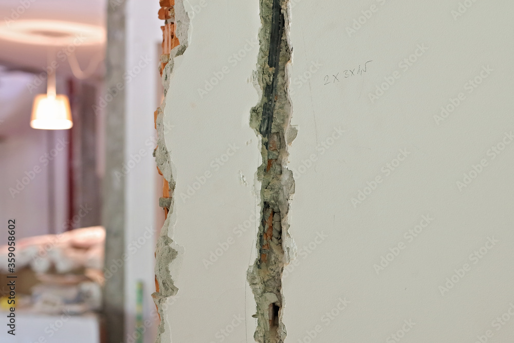 Fototapeta premium Home Renovation, Replacing the Electrical Wiring on an Old House