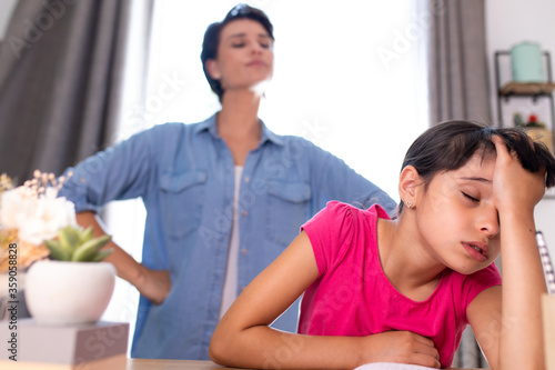 a mother not happy because her daughter does not do her school homework