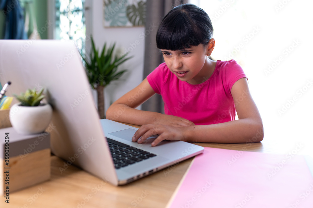 girl watching something disgusting her on a computer at home girl watching something disgusting her on a computer at home