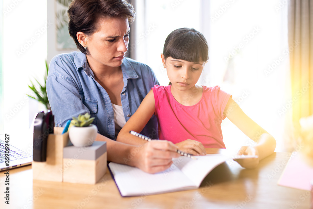 mother helping daughter understand homework mother helping daughter understand homework