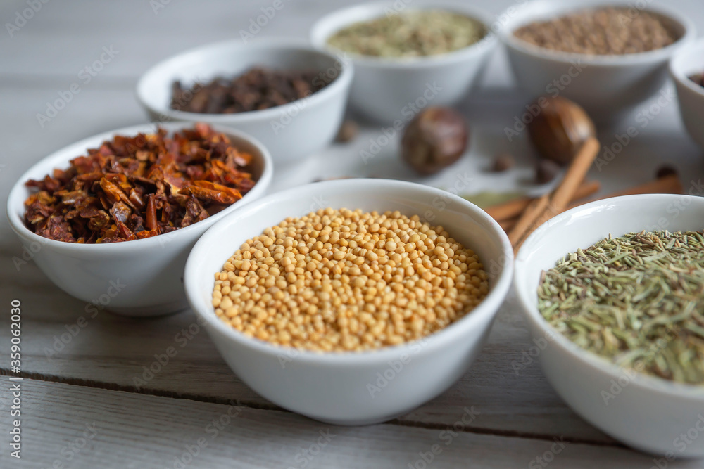 Dry seasonings and spices against a dark background view from the top.