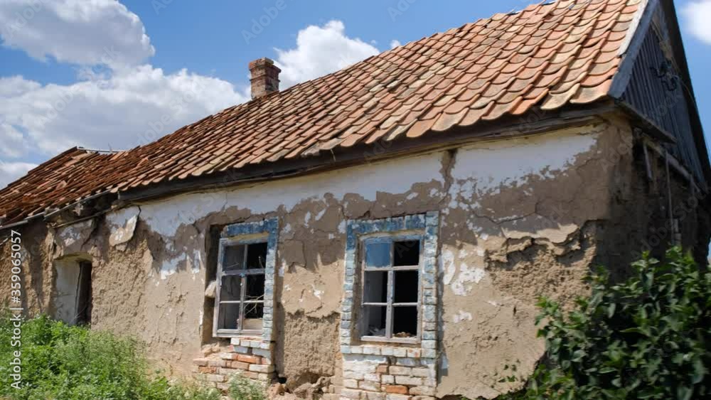 Old rural house in dilapidated condition covered with red tiles. Old rural house in dilapidated condition covered with red tiles.