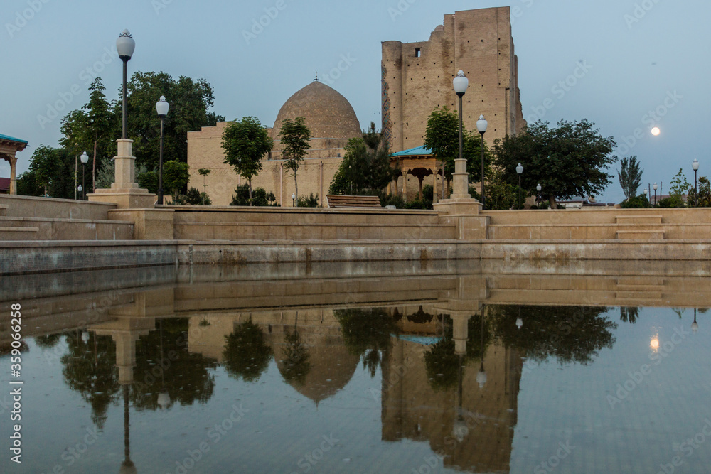 Evening view of a small pond and Dorut Tilavat complex with Kok Gumbaz mosque in Shahrisabz, Uzbekistan