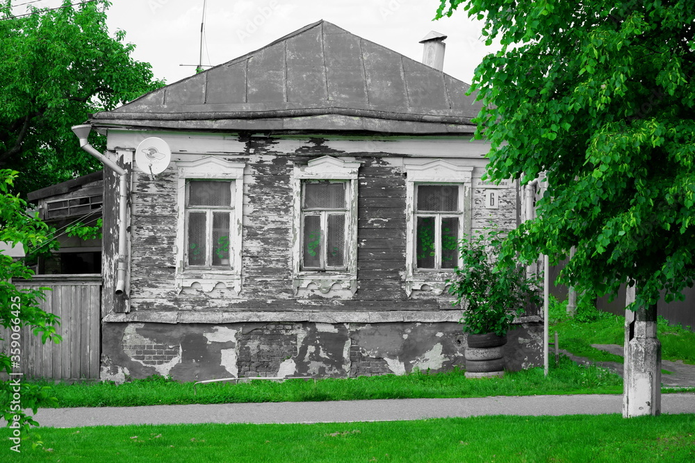 black and white old house on a green background