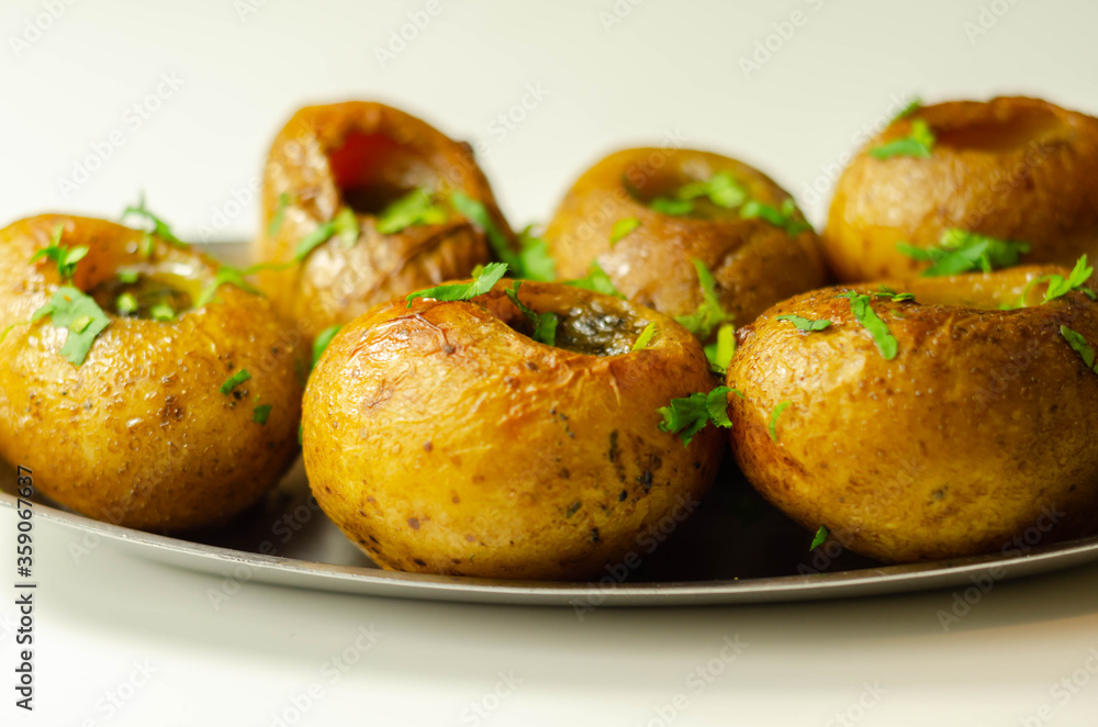 Mini jacket potatoes with a fragrant garlic butter infused with Italian truffle oil Mini jacket potatoes with a fragrant garlic butter infused with Italian truffle oil