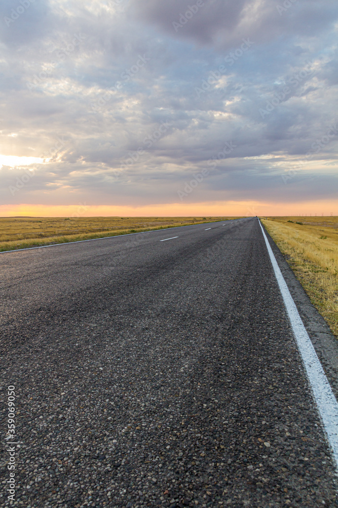 Sunset view of a road in russian steppe Sunset view of a road in russian steppe
