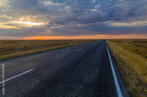 Sunset view of a road in russian steppe