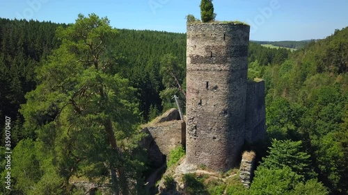 Aerial view of gothic castle ruins. Flight over Gutstejn, Czech republic, European union. Romantic ruins in wildlife. photo