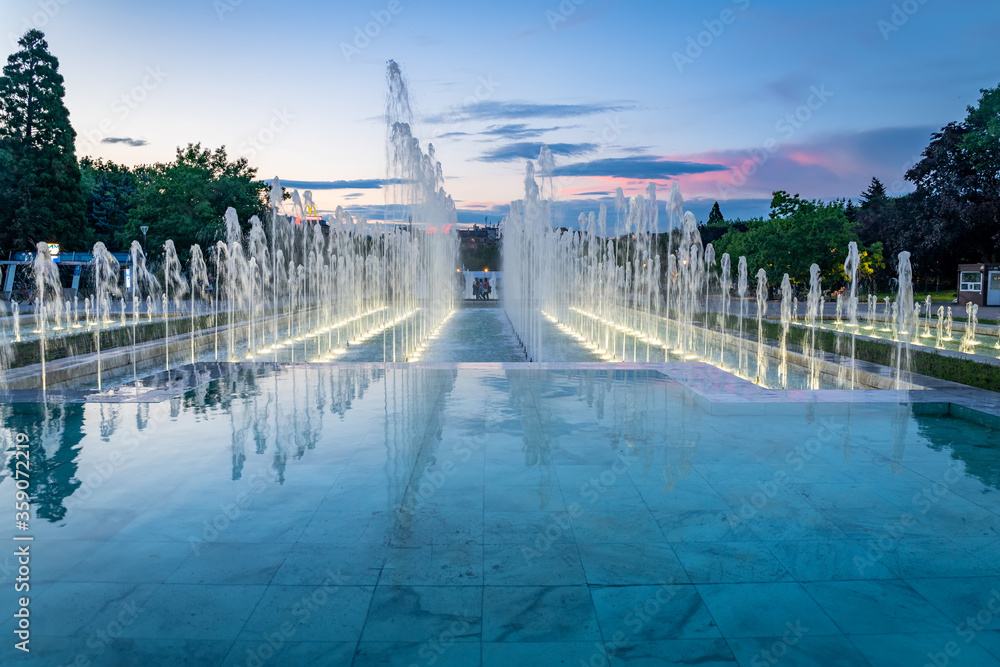 National Palace of Culture in Sofia Bulgaria with beautiful fountains in front. A popular trael and local spot in Sofia, evening mood