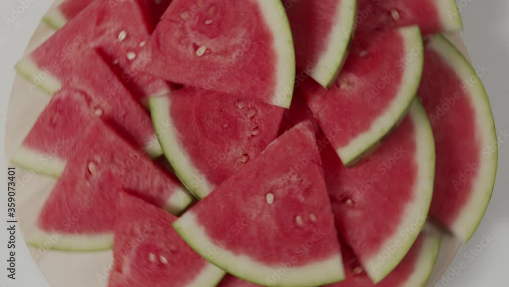 slices of watermelon rotate top view on a table slices of watermelon rotate top view on a table