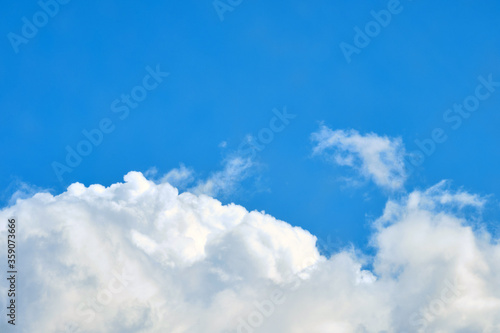 White clouds in the blue sky copy space