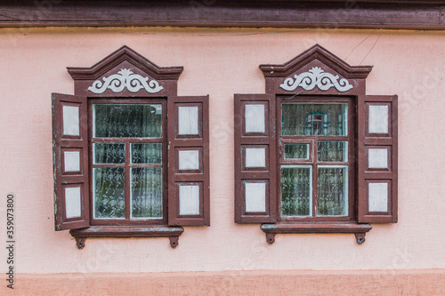 Windows of an old house in Karakol, Kyrgyzstan photo