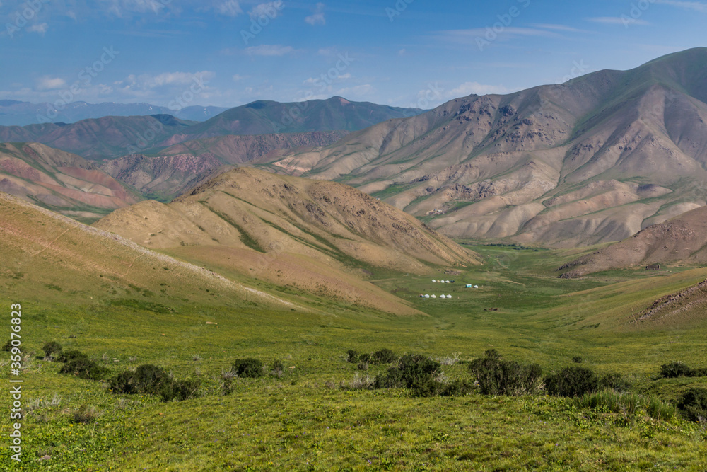 Green valley with yurt camps near Song Kul lake, Kyrgyzstan