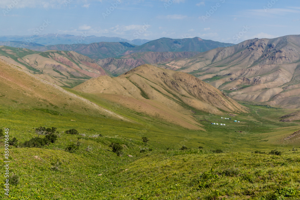 Green valleys with yurt camps near Song Kul lake, Kyrgyzstan