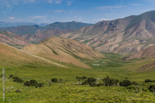Green valley with yurt camps near Song Kul lake, Kyrgyzstan