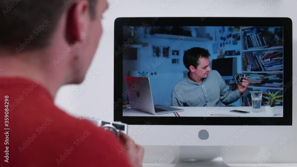 Online call. Video communication over a long distance. A man watching photo lesson in online school. Gaining knowledge over long distance from video conference. Distance education in self-isolation. Online call. Video communication over a long distance. A man watching photo lesson in online school. Gaining knowledge over long distance from video conference. Distance education in self-isolation.