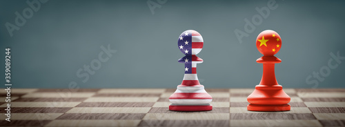 USA and China conflict. Country flags on chess pawns on a chess board. 3D illustration.