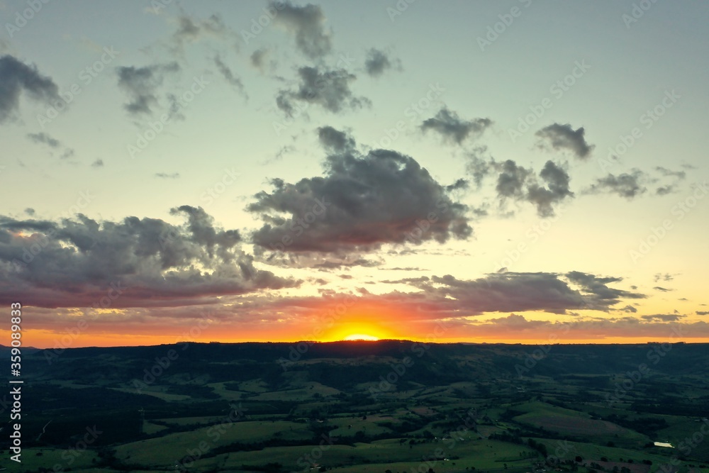 Sunset in the hill. Rural life scene. Field view. Countryside view. Sunset in the hill view. Rural life scene. Field view. Countryside view. Sunset in the hill. Rural life scene. Countryside view.