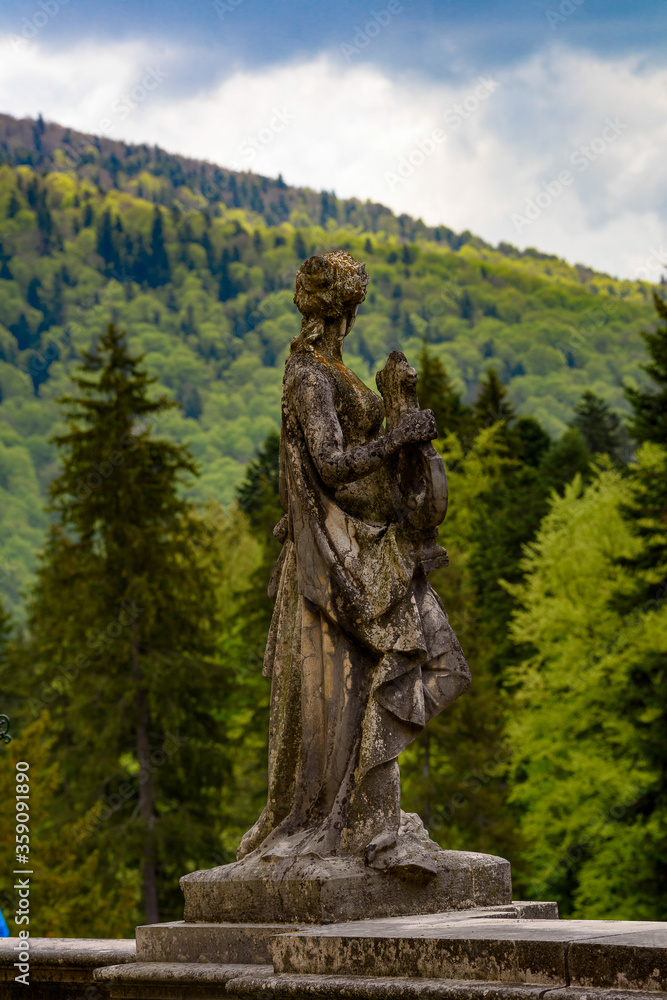 Statue at the Peles Castle, a Neo-Renaissance castle in the Carpathian Mountains, Sinaia, Prahova County, Romania Statue at the Peles Castle, a Neo-Renaissance castle in the Carpathian Mountains, Sinaia, Prahova County, Romania