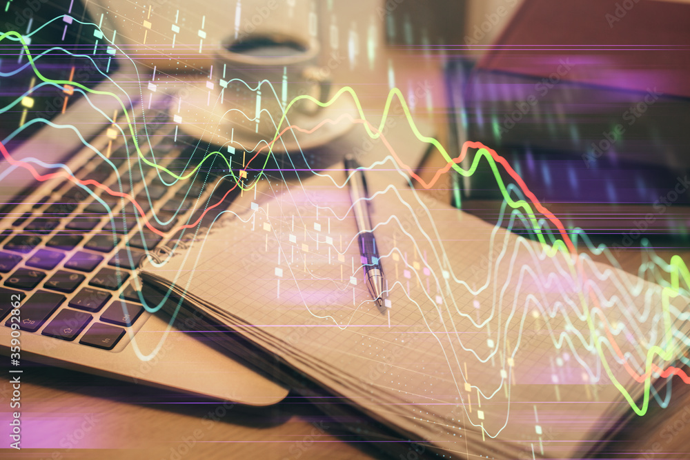 Double exposure of forex chart drawing and desktop with coffee and items on table background. Concept of financial market trading Double exposure of forex chart drawing and desktop with coffee and items on table background. Concept of financial market trading