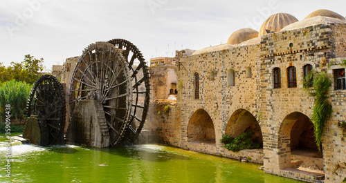 Noria of Hama, water wheel along the Orontes River in the city of Hama, Syria. photo