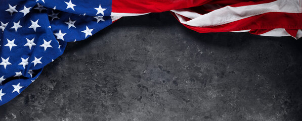 US American flag on worn black background. For USA Memorial day, Veteran's day, Labor day, or 4th of July celebration. With blank space for text.