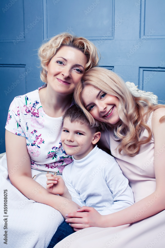 happy smiling blond family together posing cheerful on blue background, generation concept. lifestyle people happy smiling blond family together posing cheerful on blue background, generation concept. lifestyle people