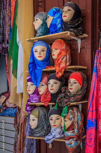 Women's head scarves on display at the market in Fes Morocco