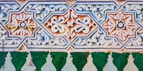 Decorative alabaster wall carvings in a Moroccan riad in Fes, Morocco photo