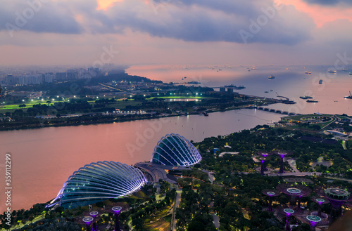 Aerial view of Cloud Forest, the Flower Dome, and the Supertree Grove in Gardens by the Bay, Singapore at sunrise
