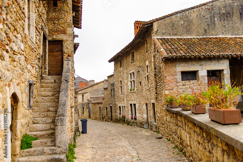 Old stone house in Perouges, France, a medieval walled town, a popular touristic attraction.