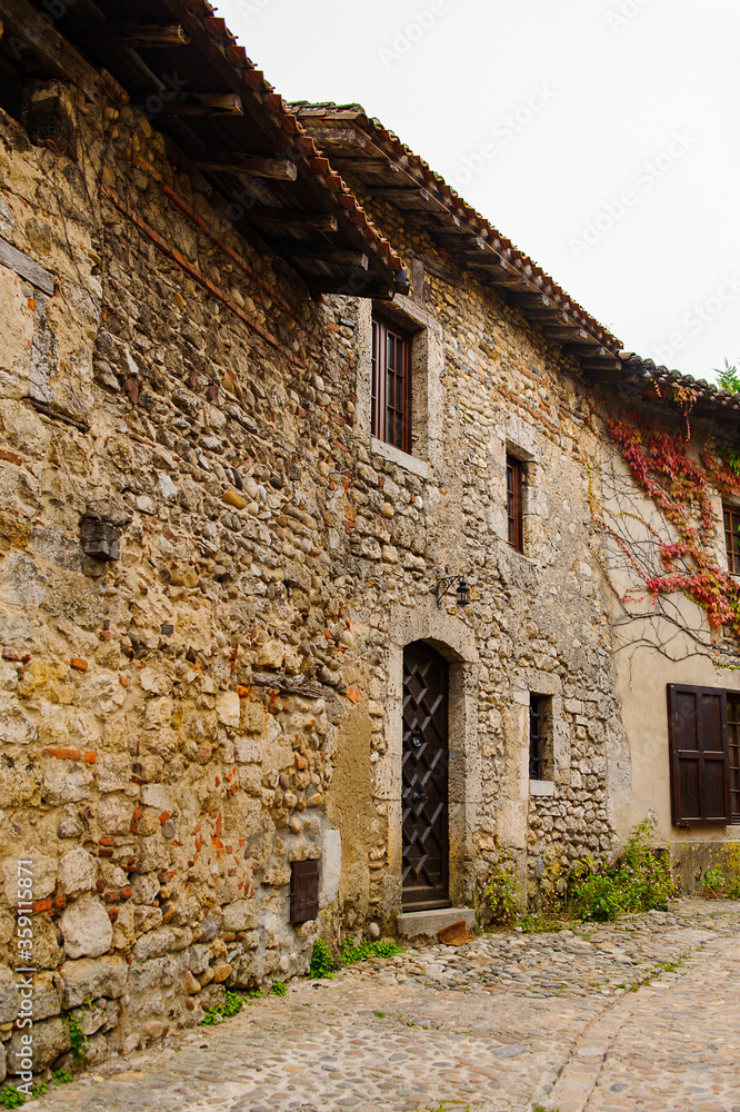 Close view of the authentic stone house of Perouges, France, a medieval walled town, a popular touristic attraction.
